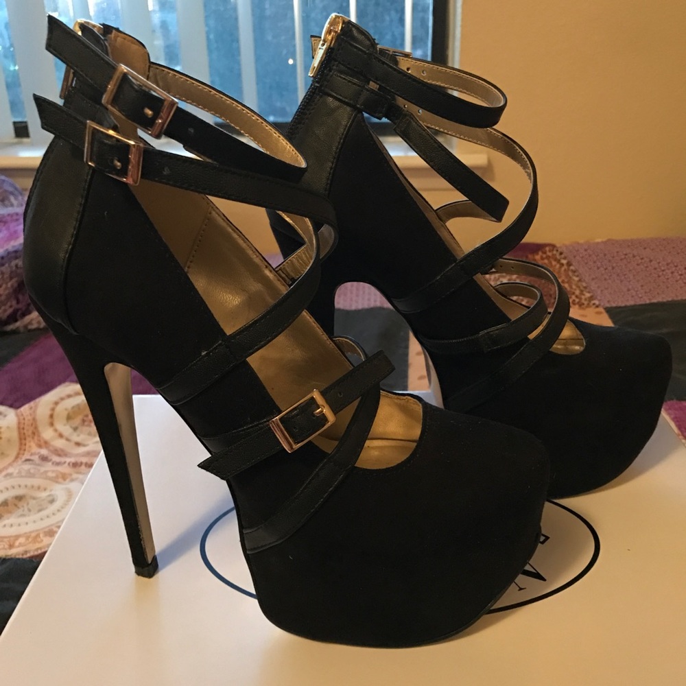 Bebe black and gold platform heels.